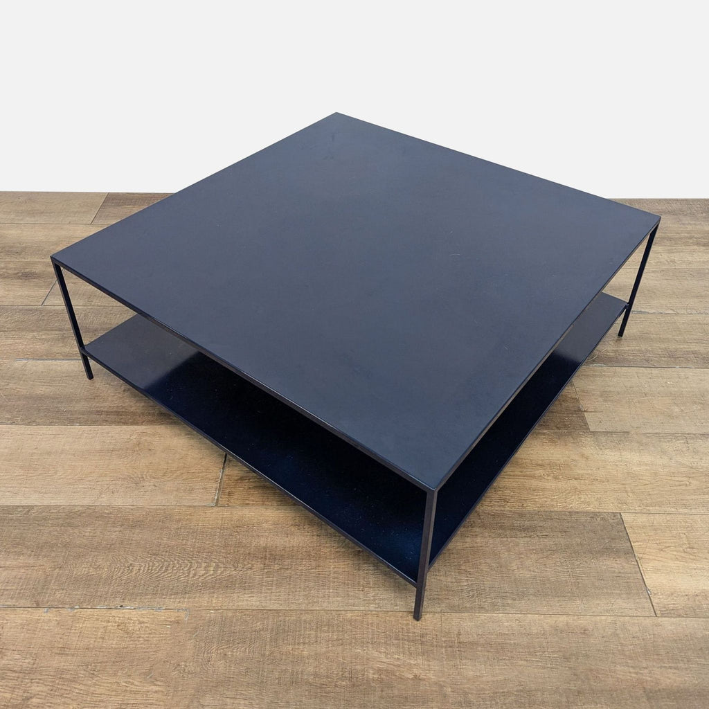 Square coffee table in an indigo finish, featuring two levels for storage.