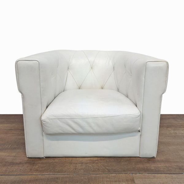 1. White West Elm lounge chair with curved back, squared arms, and diamond-tufted leather upholstery, front view.