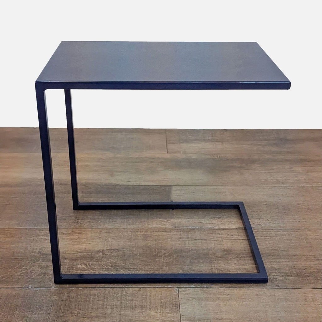 Handcrafted indigo-finished steel side table with sleek, modern design.