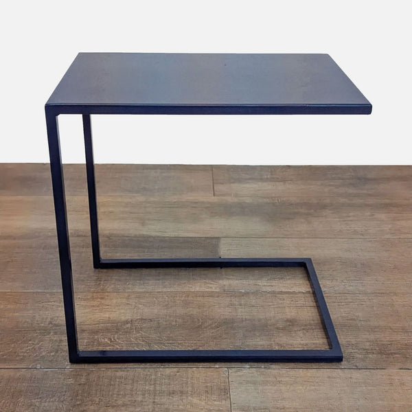 Handcrafted indigo-finished steel side table with sleek, modern design.