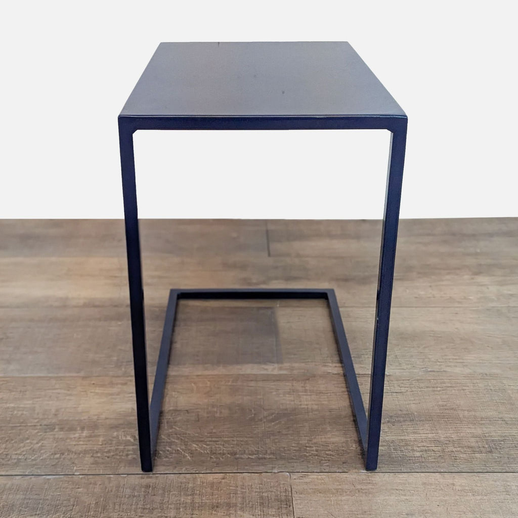 Powder-coated steel console table in indigo, featuring minimalist style.