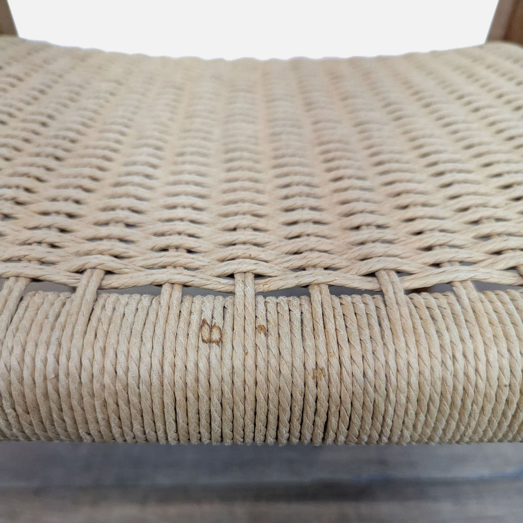 3. Close-up of woven paper cord seat detail on a Reperch chair, showing texture and craftsmanship.