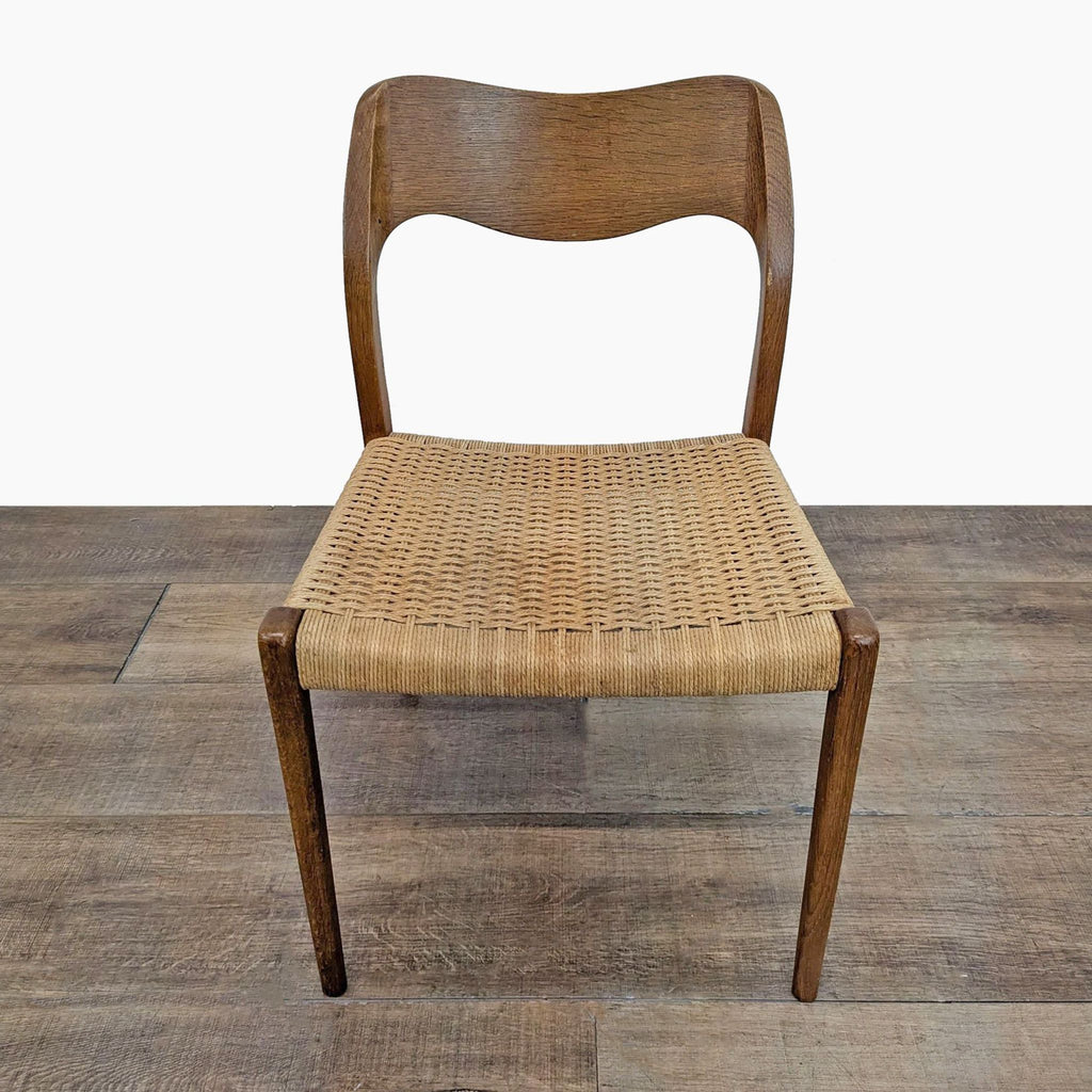 Front view of a Reperch side chair with a solid wood frame and handwoven paper cord seat.