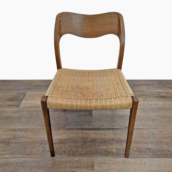 Front view of a Reperch side chair with a solid wood frame and handwoven paper cord seat.