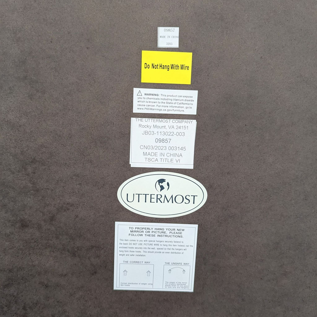 Back of Uttermost mirror showing labels and warning not to hang with wire.