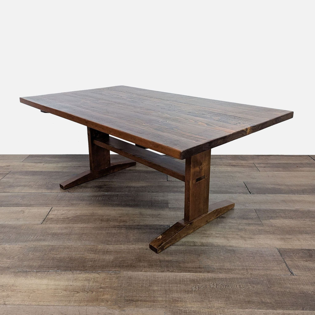 Wooden Reperch dining table with sturdy legs and rustic design.