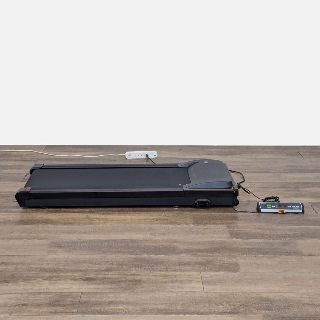 2. Lifespan under desk treadmill with control panel, plugged in and ready for walking at your workspace.