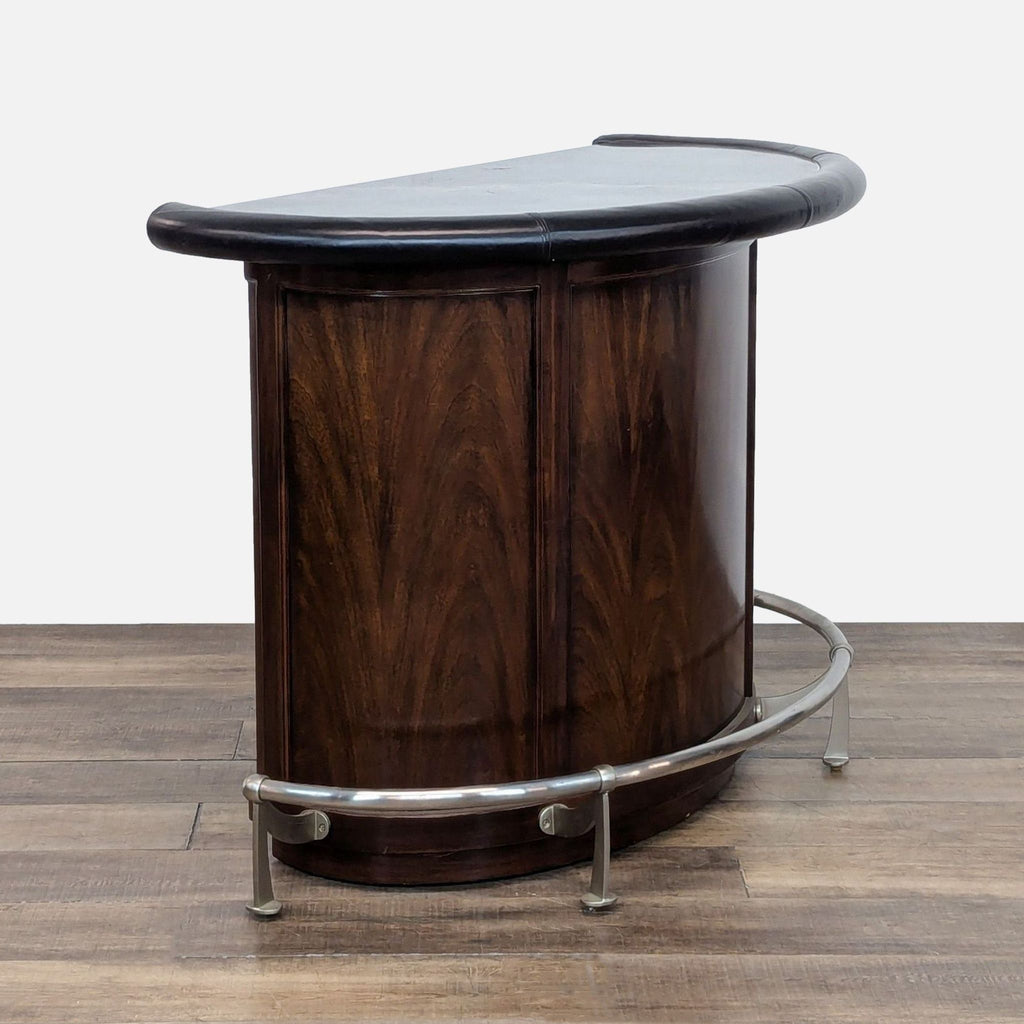 3. Angled view of Thomasville Art Deco mahogany bar featuring marble top, leather armrest, and nickel footrest.