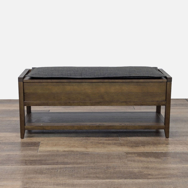 1. Wooden bench by Room & Board with a cushioned top and lower shelf, ideal for storage and seating.