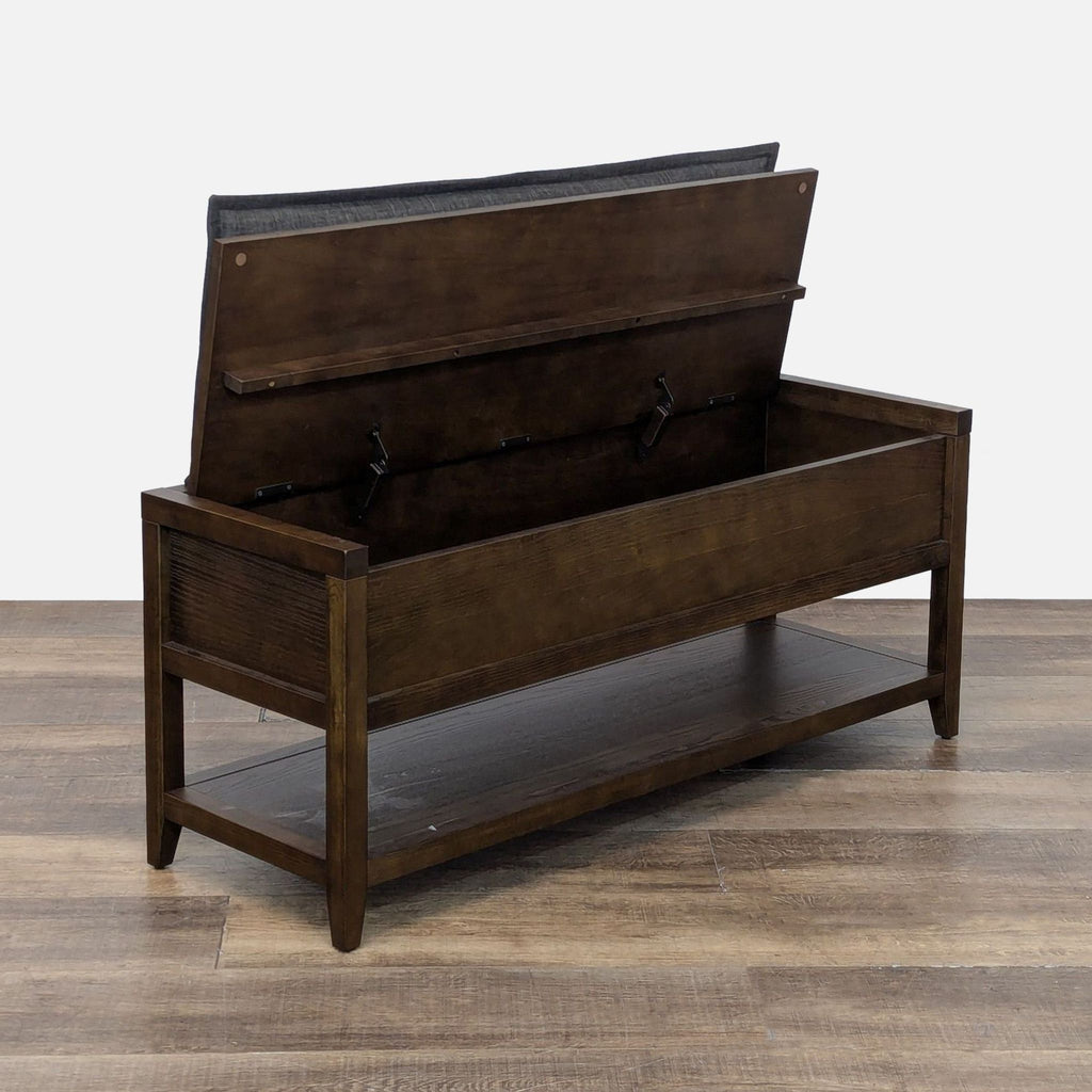 2. Room & Board storage bench with open hinged lid, showing internal space and ventilation holes.