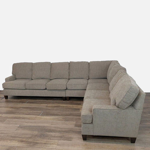 1. King Hickory sectional with track arms, thick removable cushions, and wood feet in a neutral fabric.  
