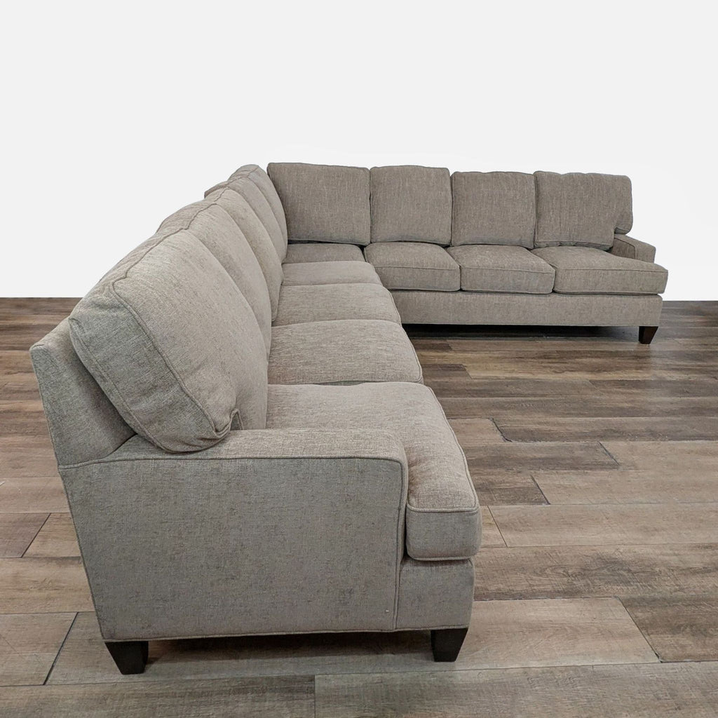 2. Angled view of a King Hickory sectional showing plush seat cushions, clean lines, and sturdy wood legs.  