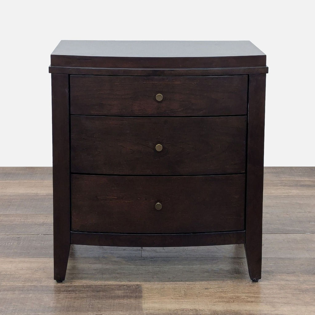 1. Crate & Barrel dark wood end table with three drawers and brass knobs, shown from the front.
