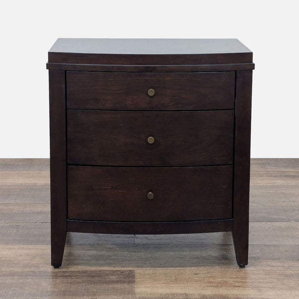 1. Crate & Barrel dark wood end table with three drawers and brass knobs, shown from the front.