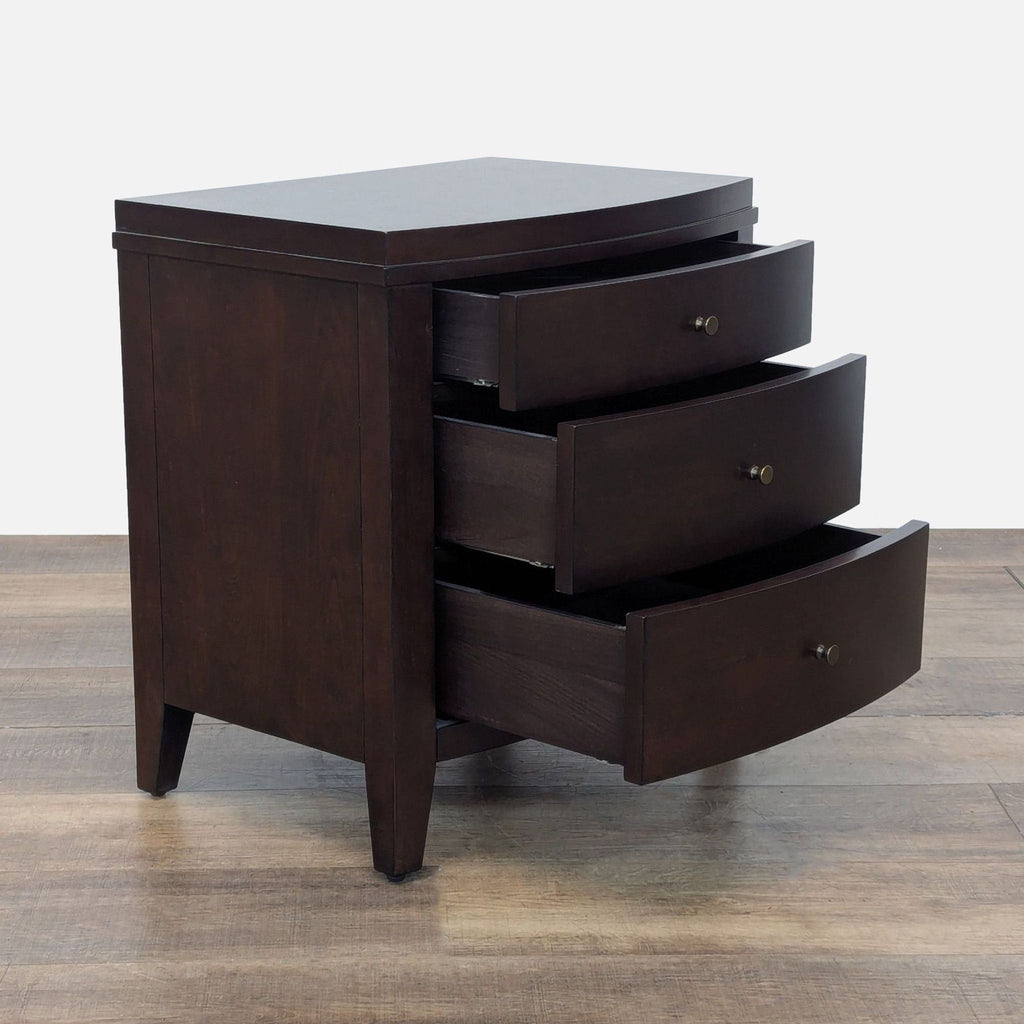 2. Angled view of Crate & Barrel end table, displaying three open curved drawers for storage.