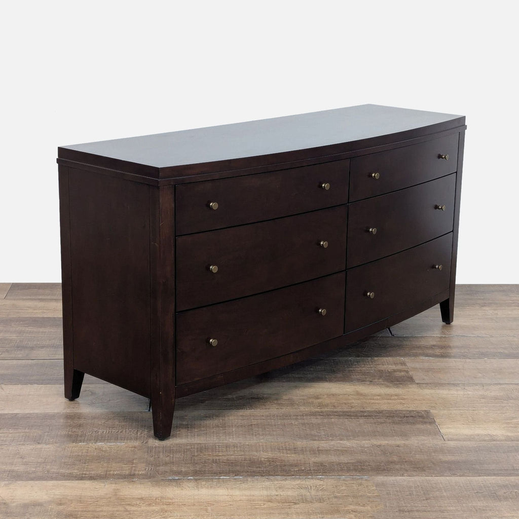 3. Six-drawer dresser from Crate & Barrel, rich dark wood, gold tone hardware, elegant and functional.