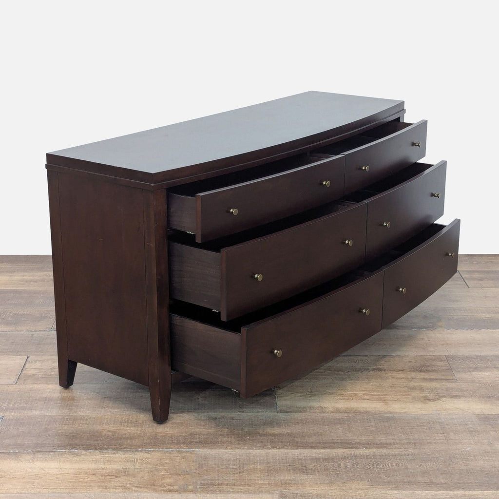 2. Modern dark wood dresser by Crate & Barrel featuring gold tone knobs on six spacious drawers.  