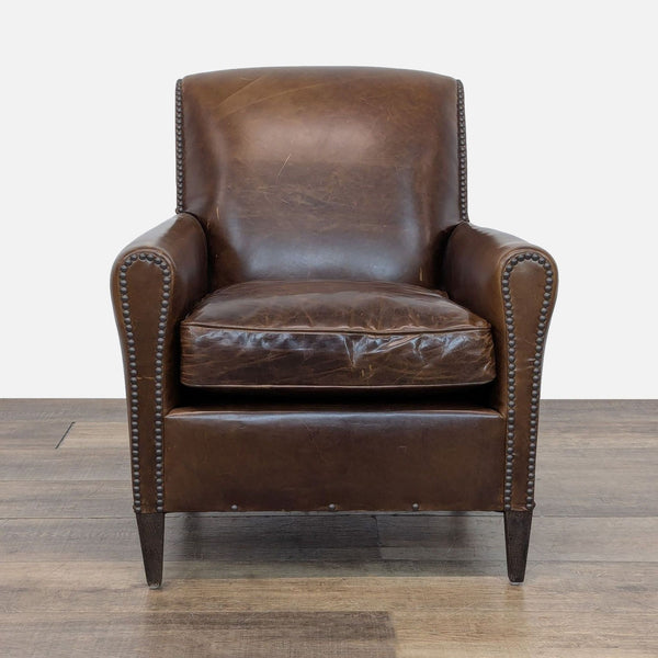 1. Restoration Hardware lounge chair with rolled arms, distressed brown leather, and nailhead trim, front view.  