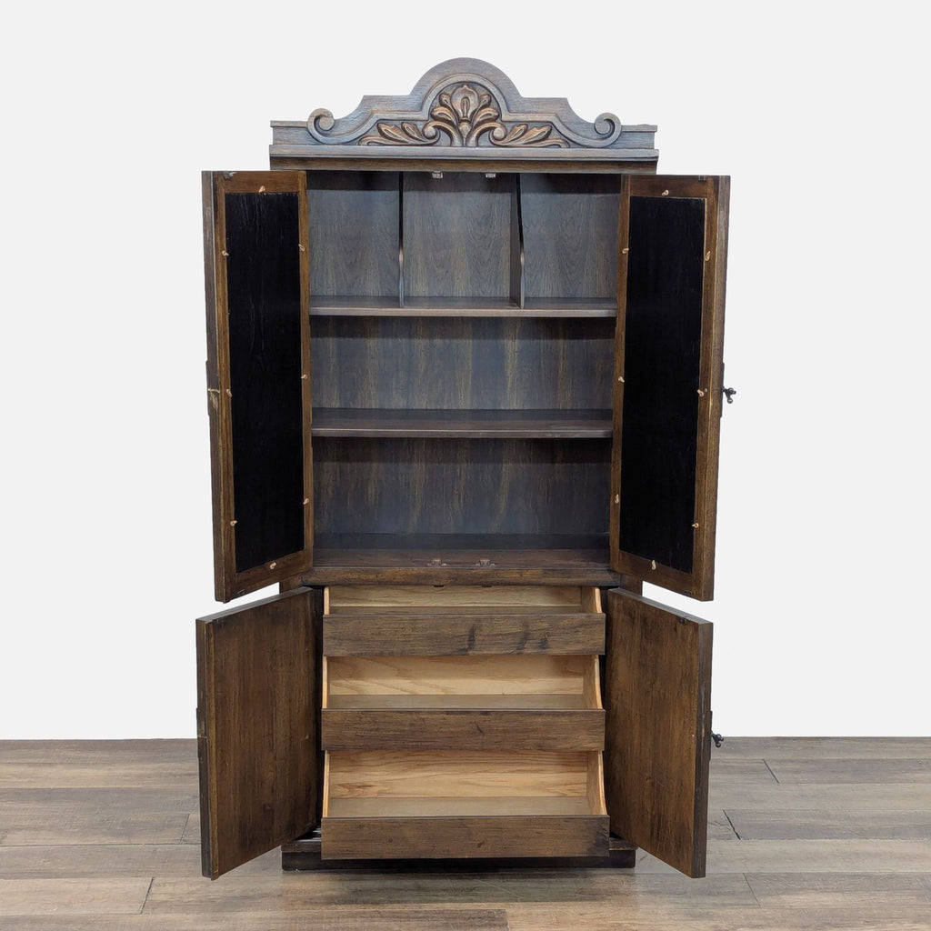 2. Reperch cabinet open, showing shelves and sliding drawers inside; features ornate carving and spindle detailing.