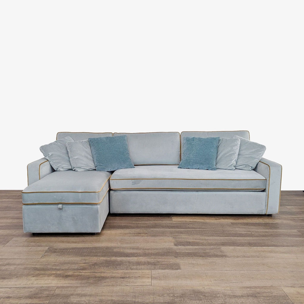1. Light blue Interior Define sleeper sofa with chaise and blue cushions, suited for both seating and lounging.