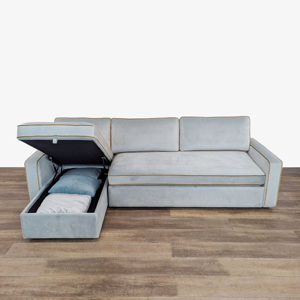 3. Reperch sectional sofa with chaise storage compartment open, revealing pillows and blanket inside.