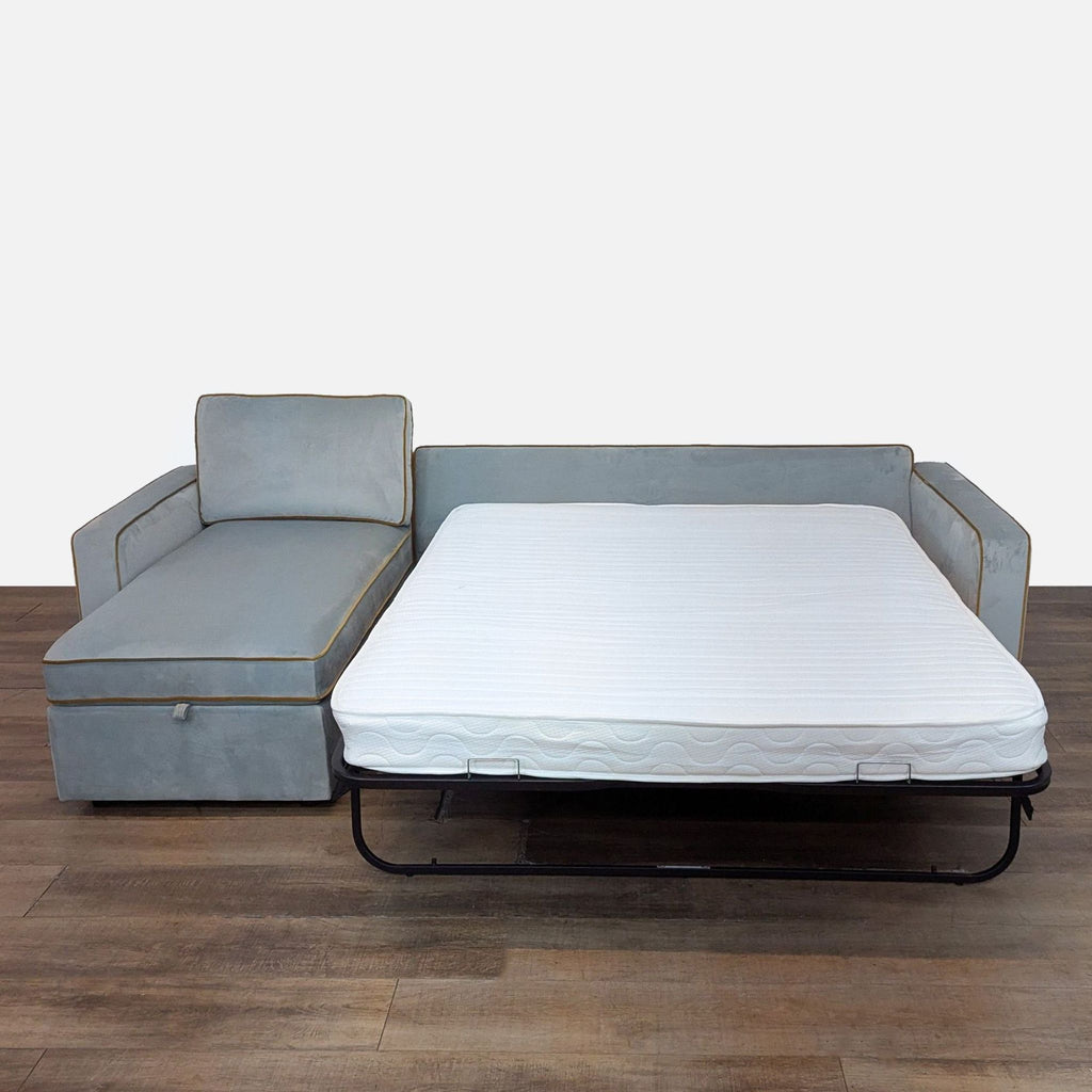 2. Reperch sleeper sofa extended with a pull-out bed and left-side chaise, showing sleeping configuration.