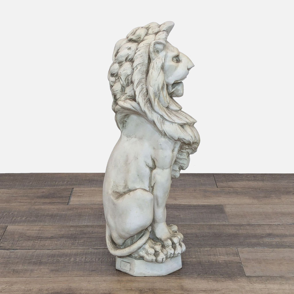 Side profile of a Reperch lion sculpture, showing fine stone-finish detail and lifelike craftsmanship.  