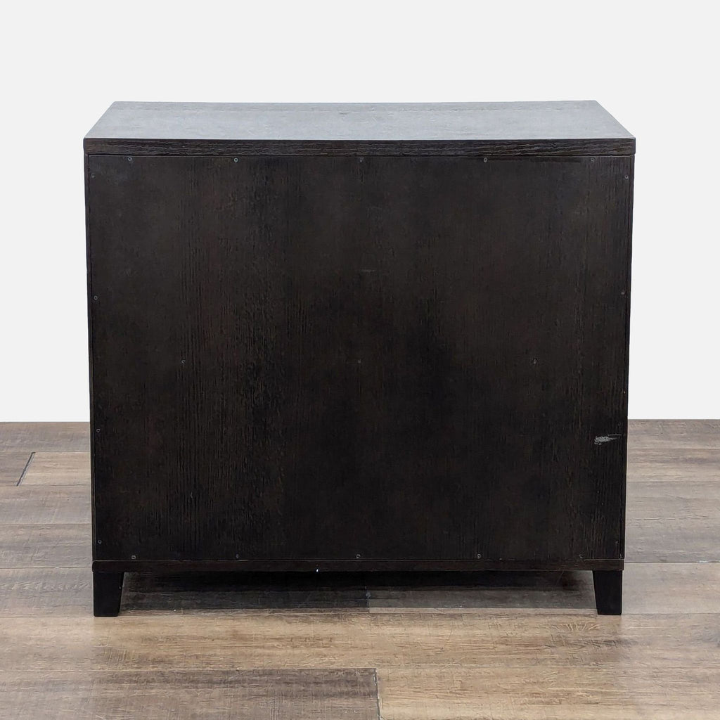 3. Rear view of a dark walnut two-drawer filing cabinet from the West Elm brand, no visible hardware.