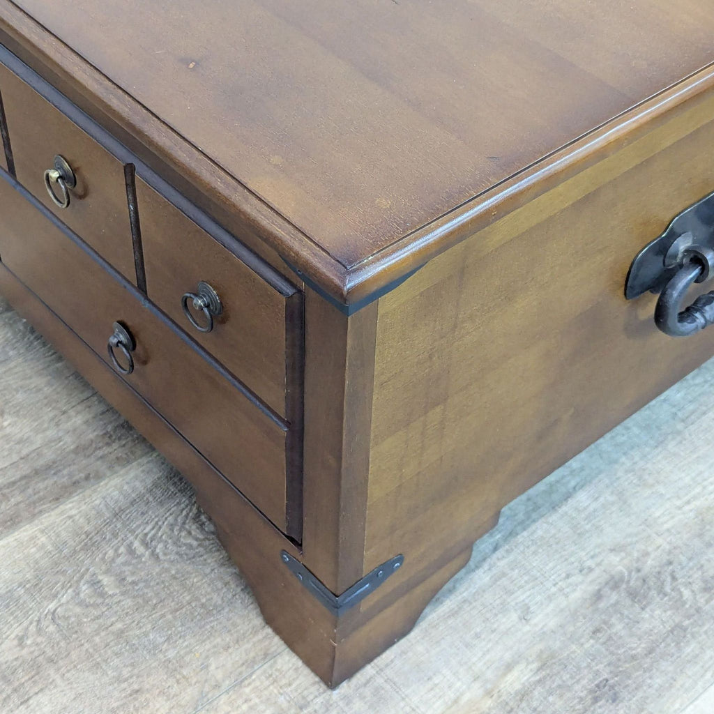 3. Detailed close-up of Reperch coffee table corner, showing metal handles and wood grain finish.
