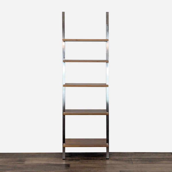 Room and Board bookshelf with a natural steel frame and maple wood shelves, shown on wood floor.