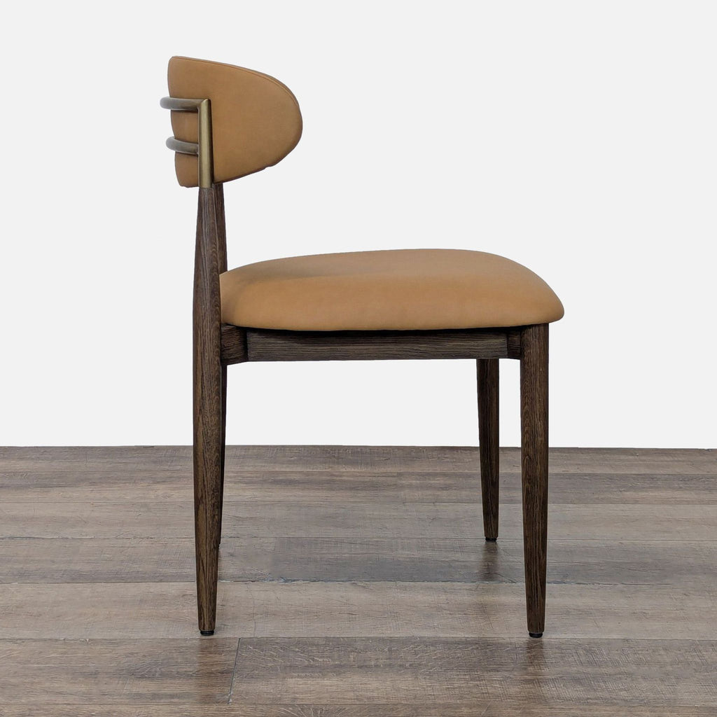 2. Side profile of a Restoration Hardware dining chair, showing cushioned seat and backrest, plus wood frame.