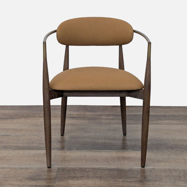 1. Front view of a Restoration Hardware dining chair with a tan upholstered seat and curved wooden arms.
