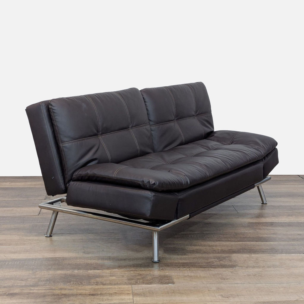 3. Side view of the Lifestyle Solutions black leather 3-seat sofa, highlighting its splitback and modern metal frame.