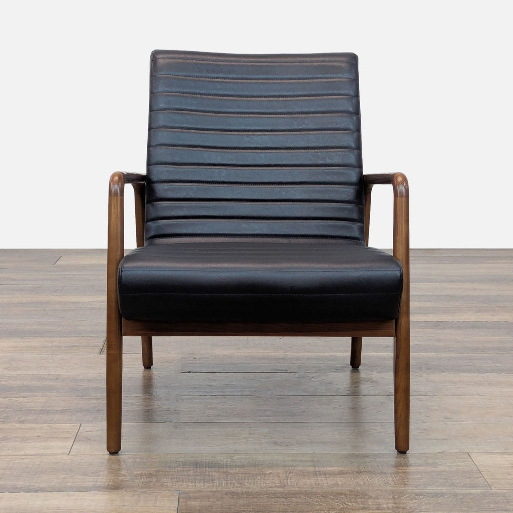 Front view of Reperch lounge chair with a solid wood frame and black leather channel-tufted upholstery.  