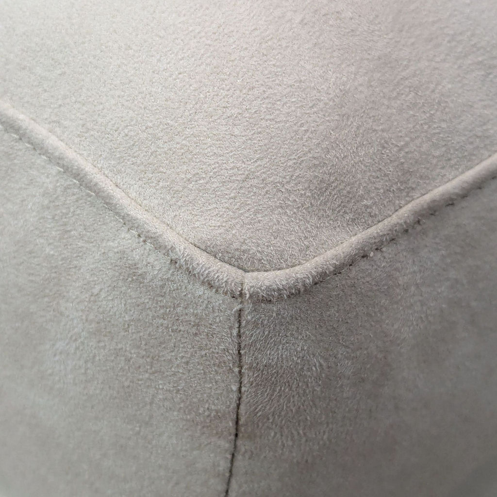 3. Close-up of the soft, textured upholstery and stitching detail on an American Leather ottoman.