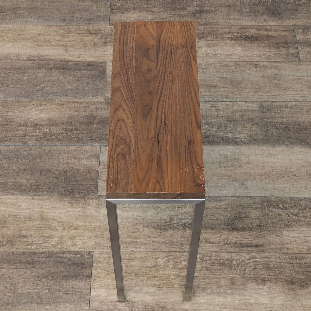 2. Top-down view of a slim Room & Board console table highlighting its natural wood grain and narrow surface.