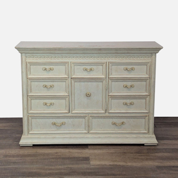 1. Thomasville solid wood dresser with white wash finish, metal drawer pulls, and decorative details, closed drawers.