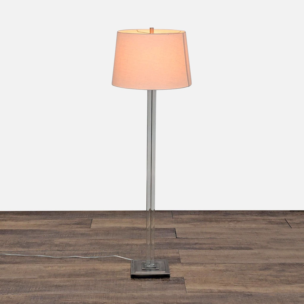 1. Restoration Hardware floor lamp with four clear columns, chrome metal base, and linen drum shade for lighting.