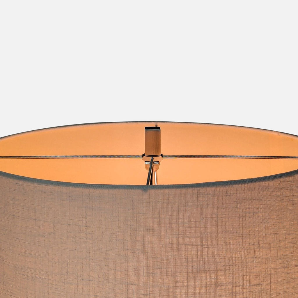 3. Top view showing the linen drum shade and metal hardware of a Restoration Hardware lighting floor lamp.