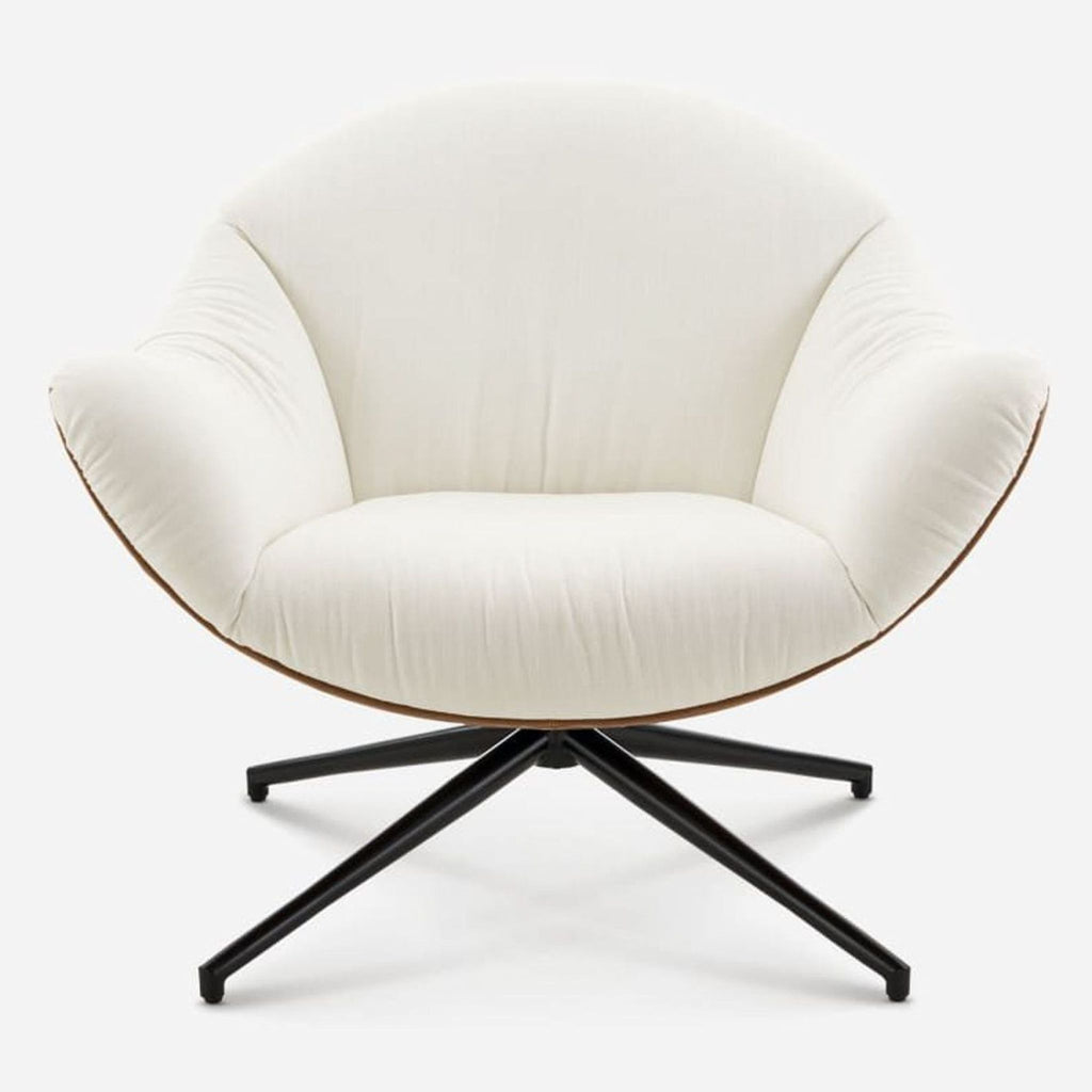 1. Front view of Castlery Arden Swivel Armchair in cream fabric and brown sides, with sleek black swivel base.