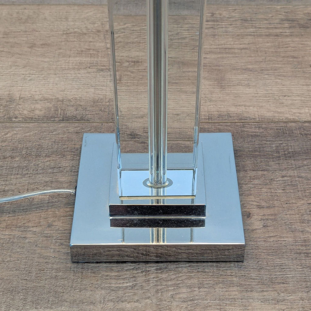 2. Close-up of Restoration Hardware lamp’s square aluminum base and crystal-clear glass column.