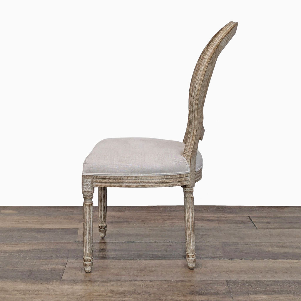 Side view of a neoclassical dining chair with a weathered oak frame and upholstered seat, dining chair category.