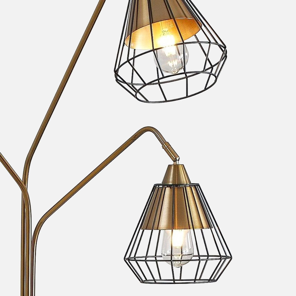 2. Close-up of Midtown lamp wire shades in black and gold, showing bulb detail and elegant design.