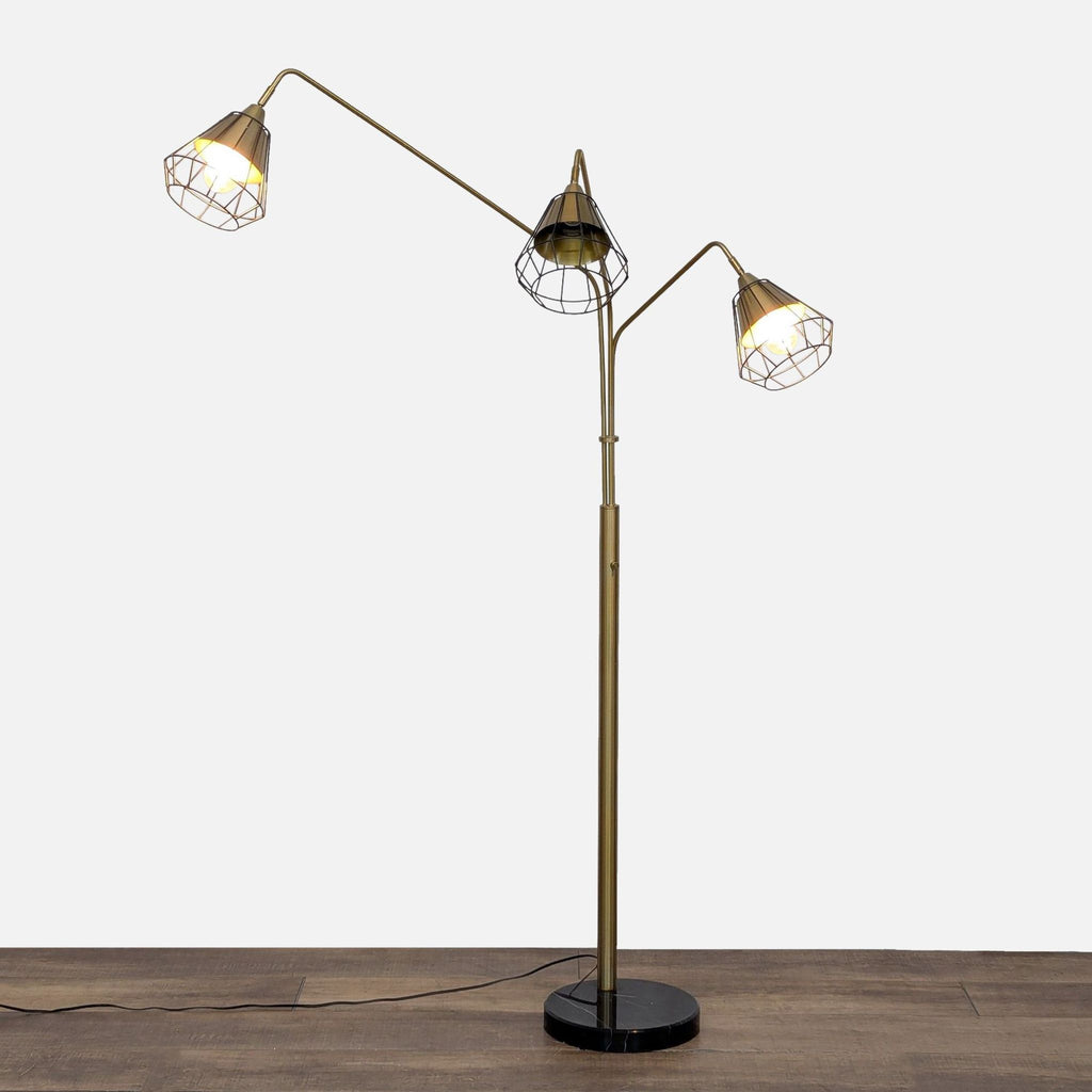 3. Midtown adjustable floor lamp with three geometric wire shades on a sturdy black marble base, category: lighting.