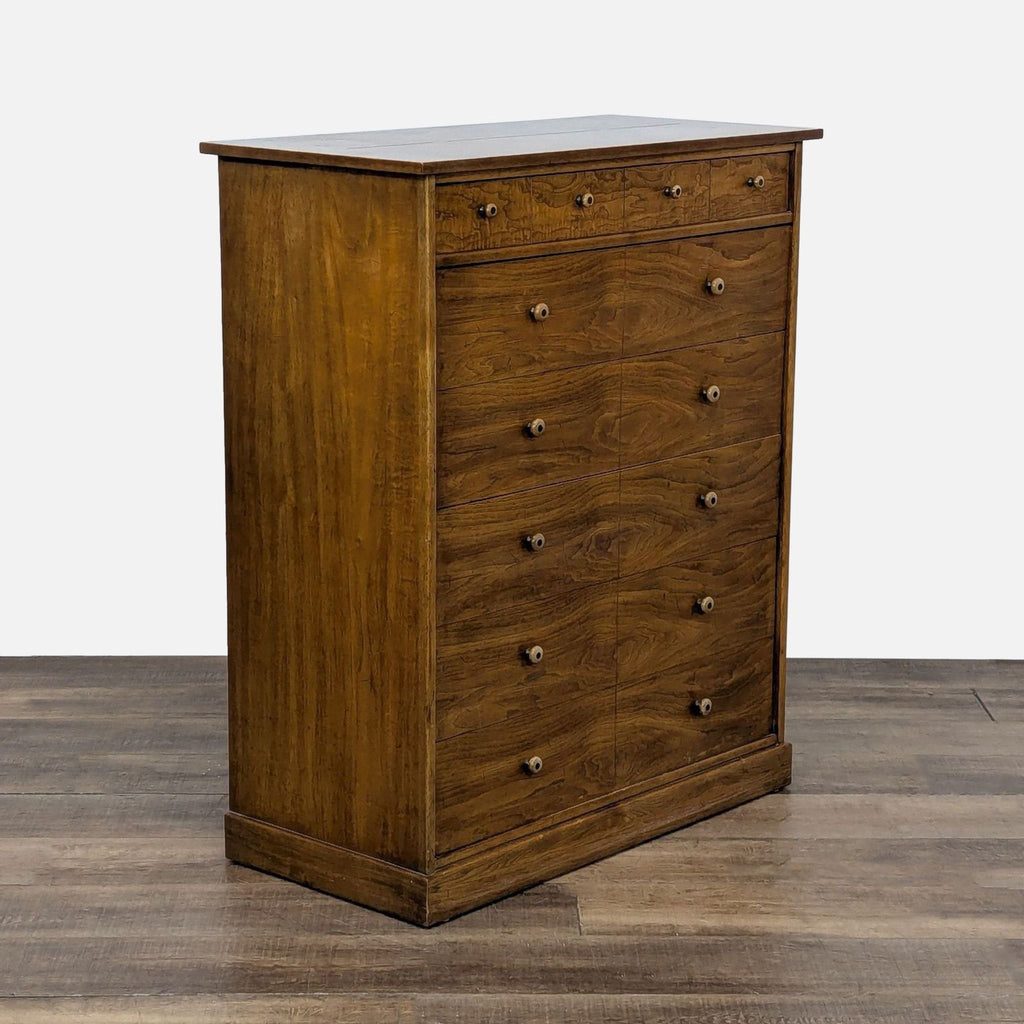 3. Angled view of a Drexel solid wood dresser with six dovetail drawers and knob hardware, closed drawers.