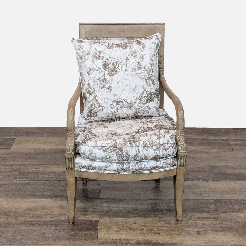 1. Front view of a Reperch lounge chair with exposed wood frame and floral upholstered cushions.