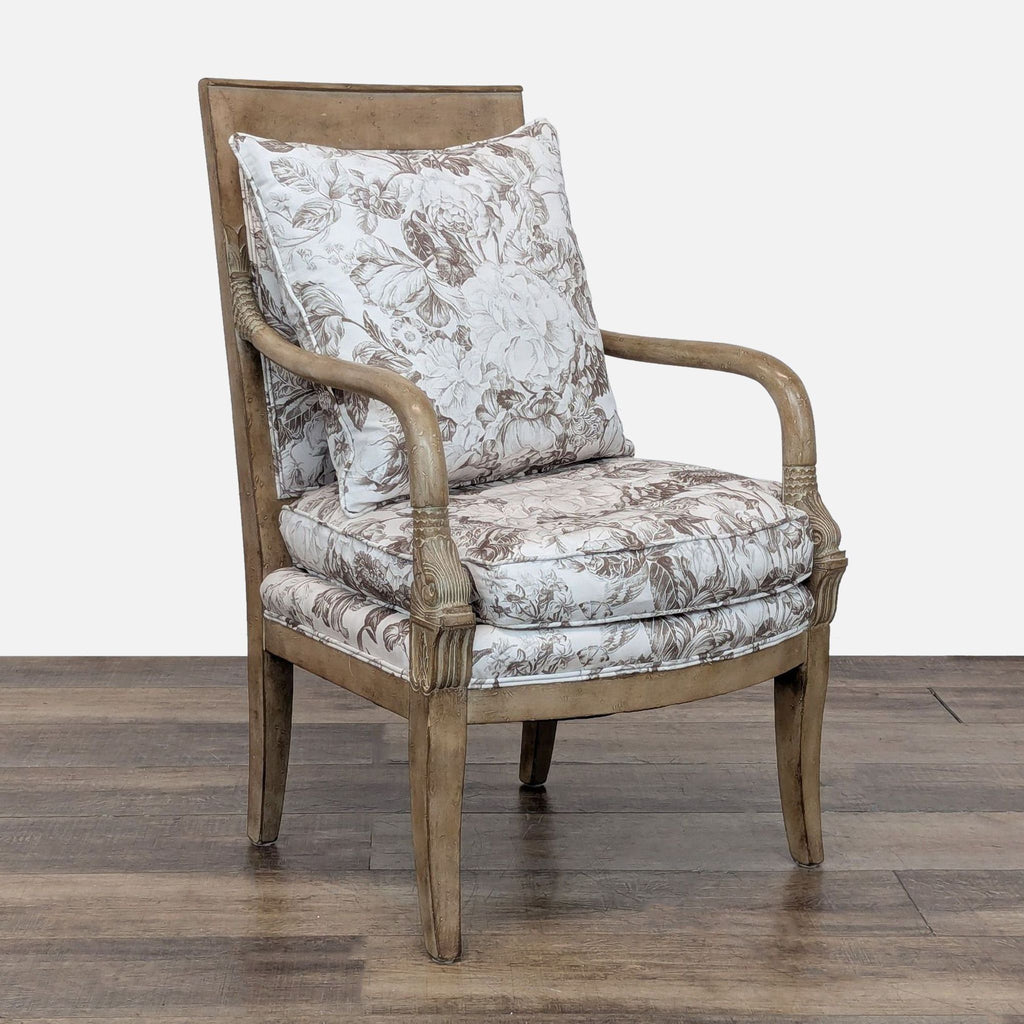 3. Angled view of Reperch lounge chair featuring carved wood detailing and floral cushions for comfort.