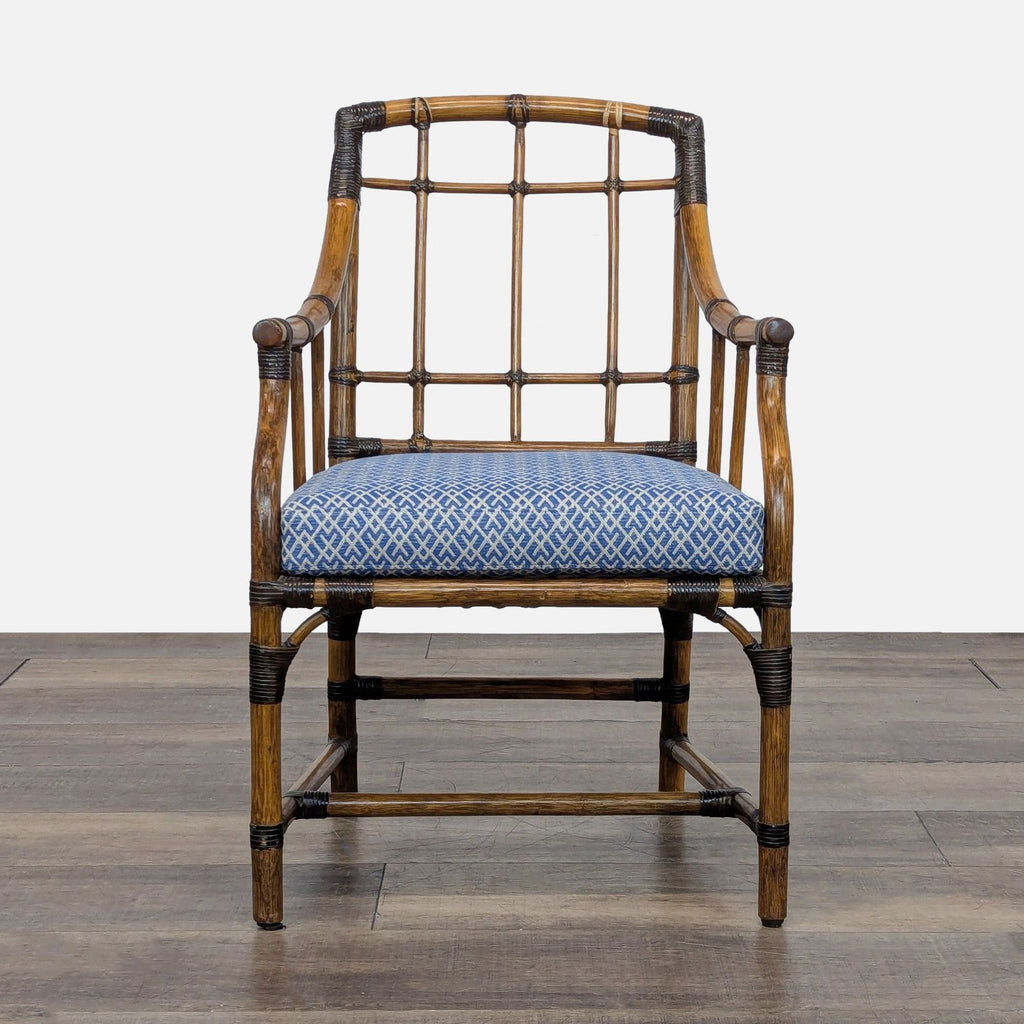 1. Front view of a McGuire San Francisco dining chair with woven rawhide bindings and blue patterned cushion.