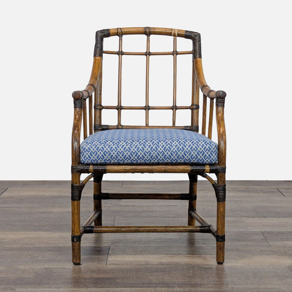 1. Front view of a McGuire San Francisco dining chair with woven rawhide bindings and blue patterned cushion.