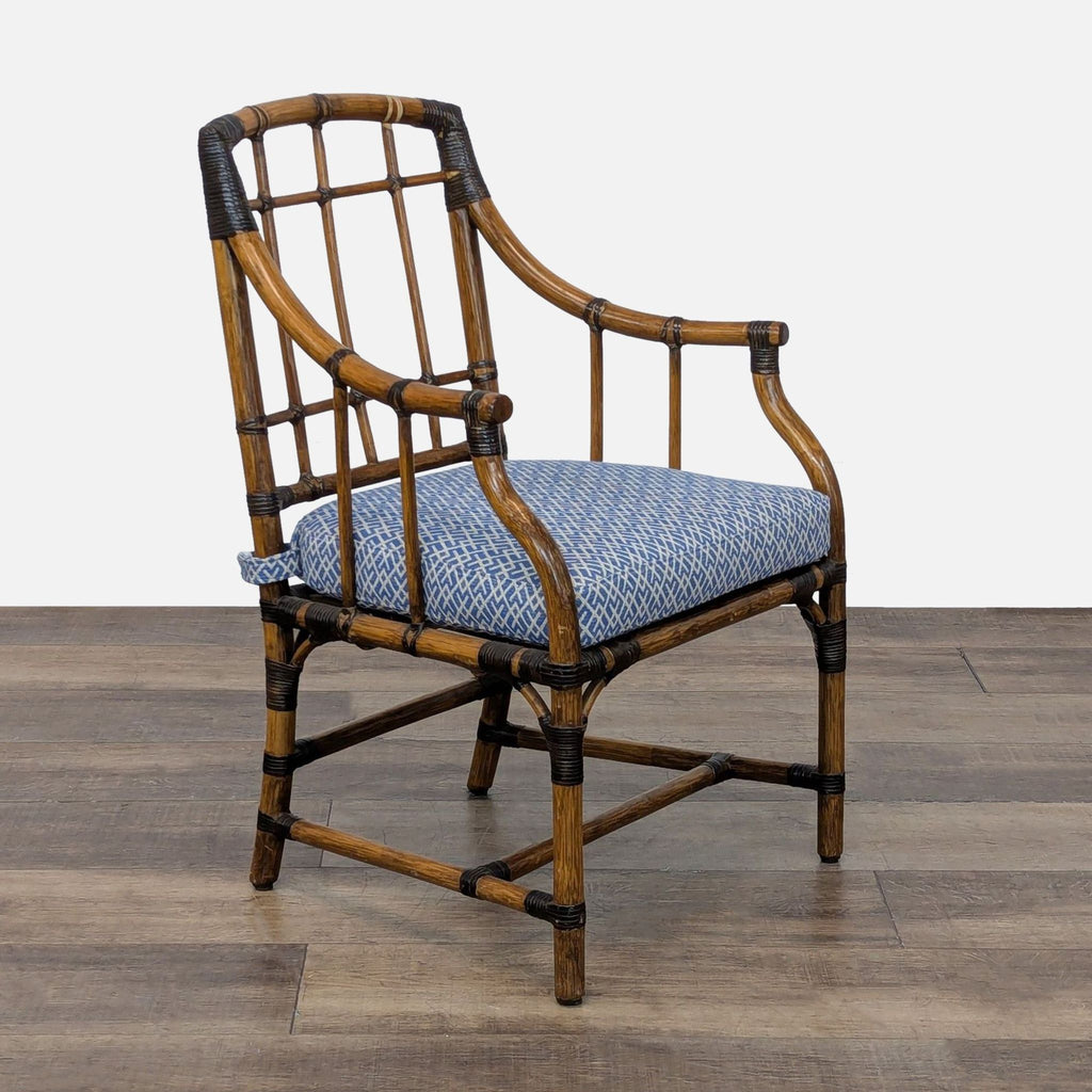 2. Angled side view of a McGuire San Francisco dining chair, showing intricate rattan frame and blue seat.
